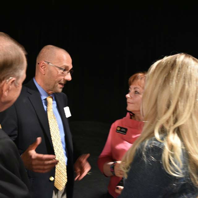 Dr. Dan Theodorescu, Director of the University of Colorado Cancer Center, speaks with Representative Dianne Primavera