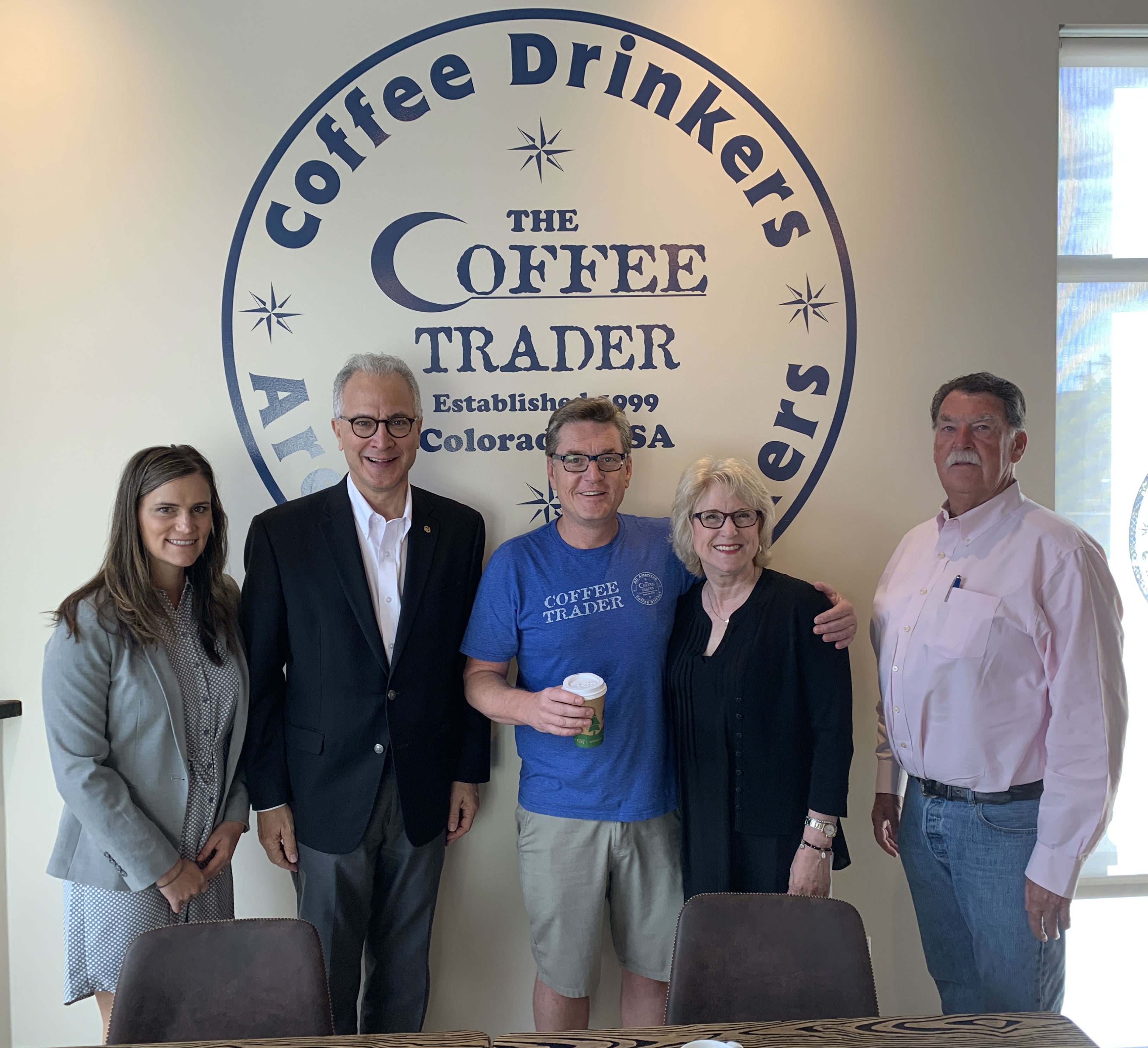 Heather Retzko (Assistant VP of State Relations, OGR) joins CU President Mark Kennedy and wife Debbie along with Senator Don Coram (R-Montrose) and his son Dee at the coffee shop Dee owns in Montrose.