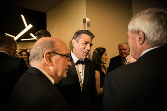 Alumnus Chris Fowler of ESPN talks with Chancellor Phil DiStefano and President Bruce Benson