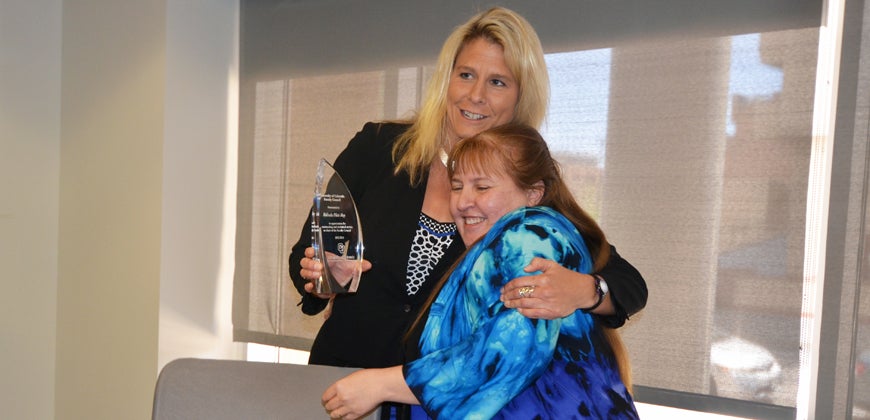 Incoming chair Laura Borgelt honors Melinda Piket-May