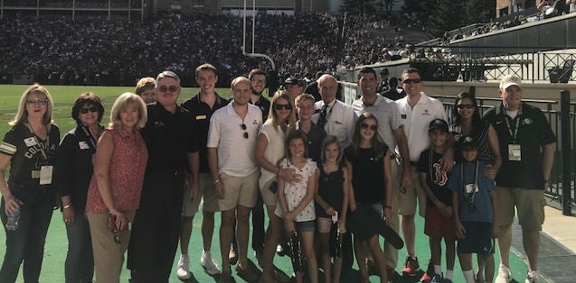 Regents Sharkey, Griego, Kroll and Carson along with President Benson and Chancellor Horrell pose for a picture with Senators Hill, Holbert and Representative Hansen and their families.