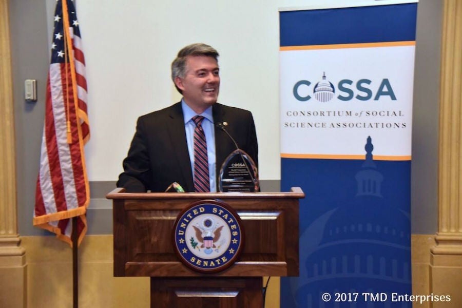 Senator Cory Gardner accepts the COSSA award