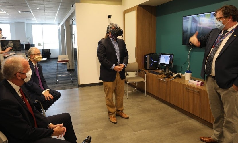 CO Senator Gardner experiences Virtual Reality while touring the NMHIC with KS Senator Moran, CU President Kennedy, and Matt Vogl, NBHIC Executive Director