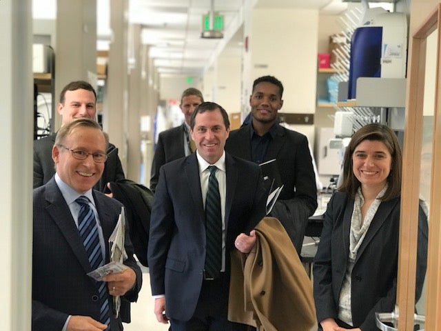 Congressman Jason Crow with J. Mark Petrash and M. Valeria Canto-Soler at CU Anschutz Medical Campus