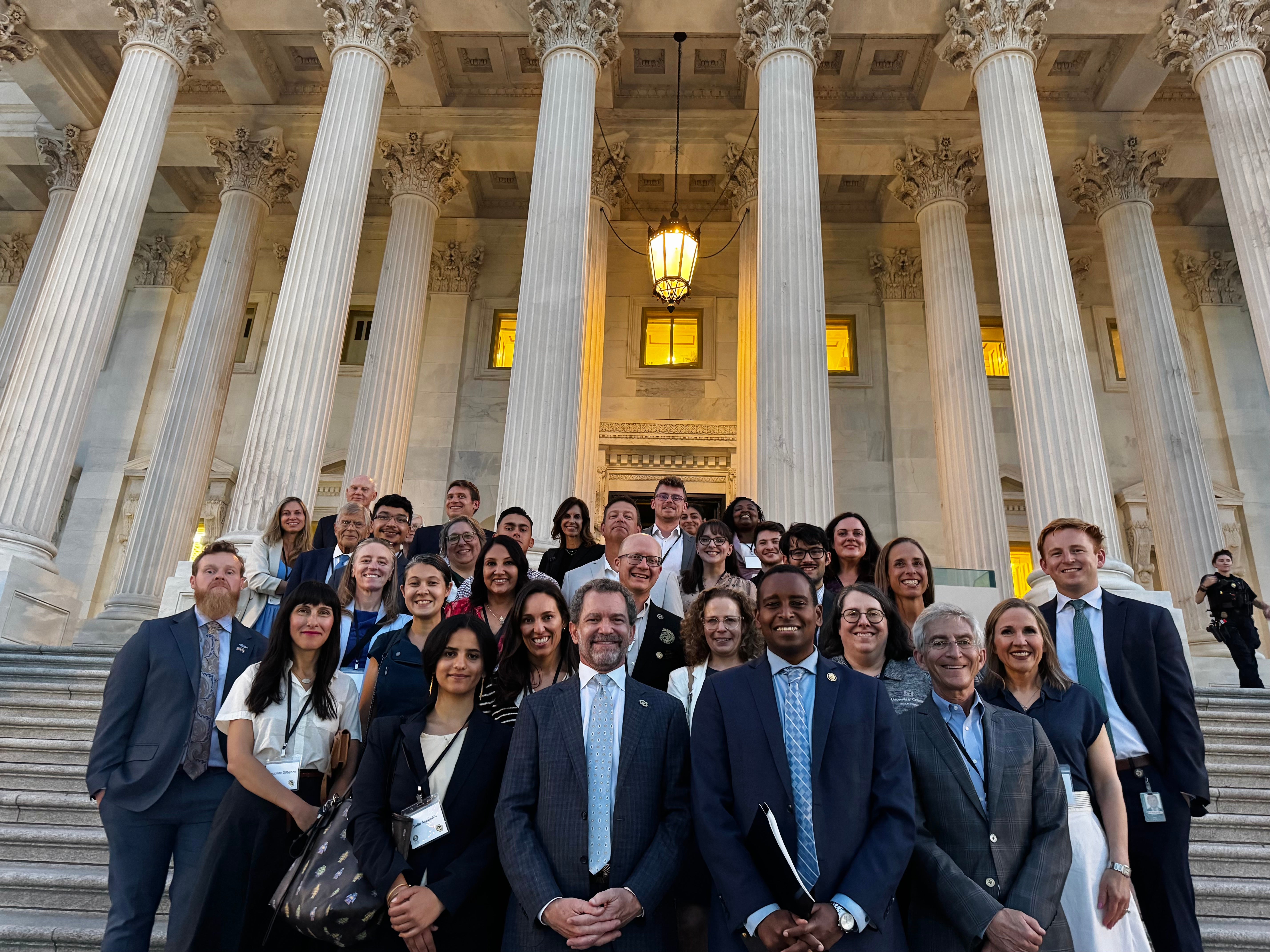 Group of CU in DC conference attendees posing with Rep. Joe Neguse (D-CO).