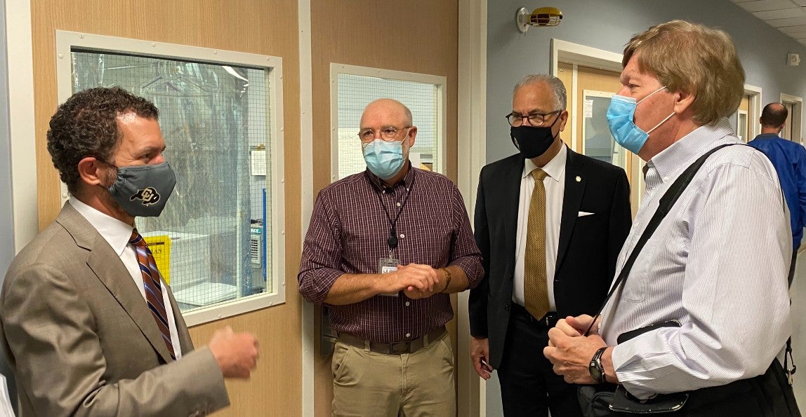 Incoming CU President Todd Saliman and CU President Mark Kennedy meets with LASP Director Daniel Baker and LASP Executive Associate Director, Finance and Operations, Randy Siders