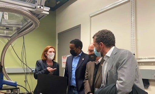 Vice Chancellor for Research and Innovation Terri Fiez, Colorado Rep. Joe Neguse, CU Boulder Chancellor Phil DiStefano, and CU President Todd Saliman at JILA. 