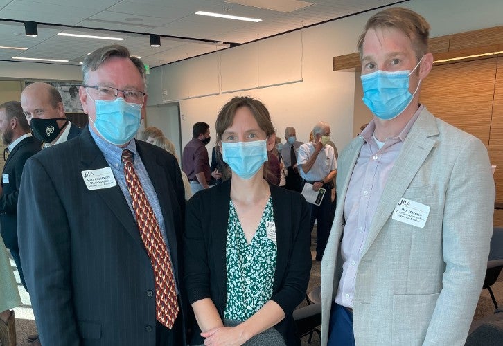 Representative Mark Baisley (R- Roxborough Park), JILA Fellow Cindy Regal and Cubit Quantum Initiative Executive Director Phil Makotyn posing at a JILA (Joint Institute for Laboratory Astrophysics) celebration reception