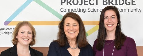 Congresswoman Diana DeGette (center) stands with Project Bridge founder Erin Golden (left) and president Lisbet Finseth.