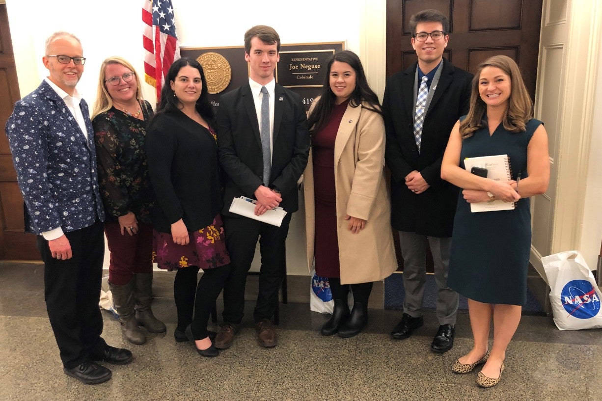 Chris Koehler (Director, COSGC), Barb Sobhani (Red Rocks CC) and students from Red Rocks and Arapahoe Community College outside the office of Congressman Joe Neguse