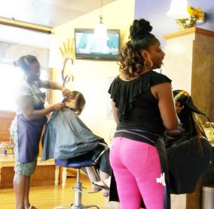 Stylists from Crowning Glory pamper youth at Roots of Change