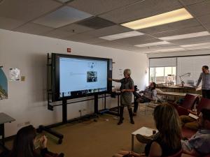 Lois Brink using the Microsoft Surface Hub to lead a classroom lecture.
