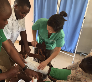 Dr. Jen Zhan, an emergency medicine resident, teaches splinting with readily available supplies in Zambia.