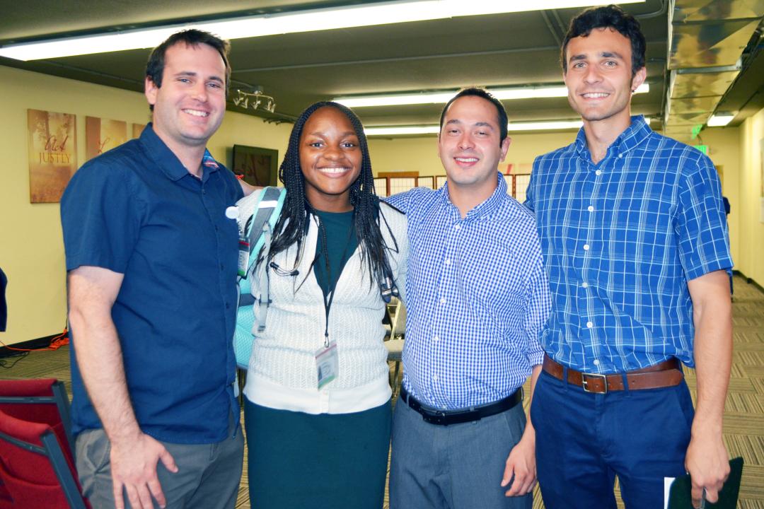 Nick Arlas, Andrea Mariani, Graduate School student, and Joaquin Quintana, professional research assistant at CU Boulder, chat before going into the weekly ‘huddle.’