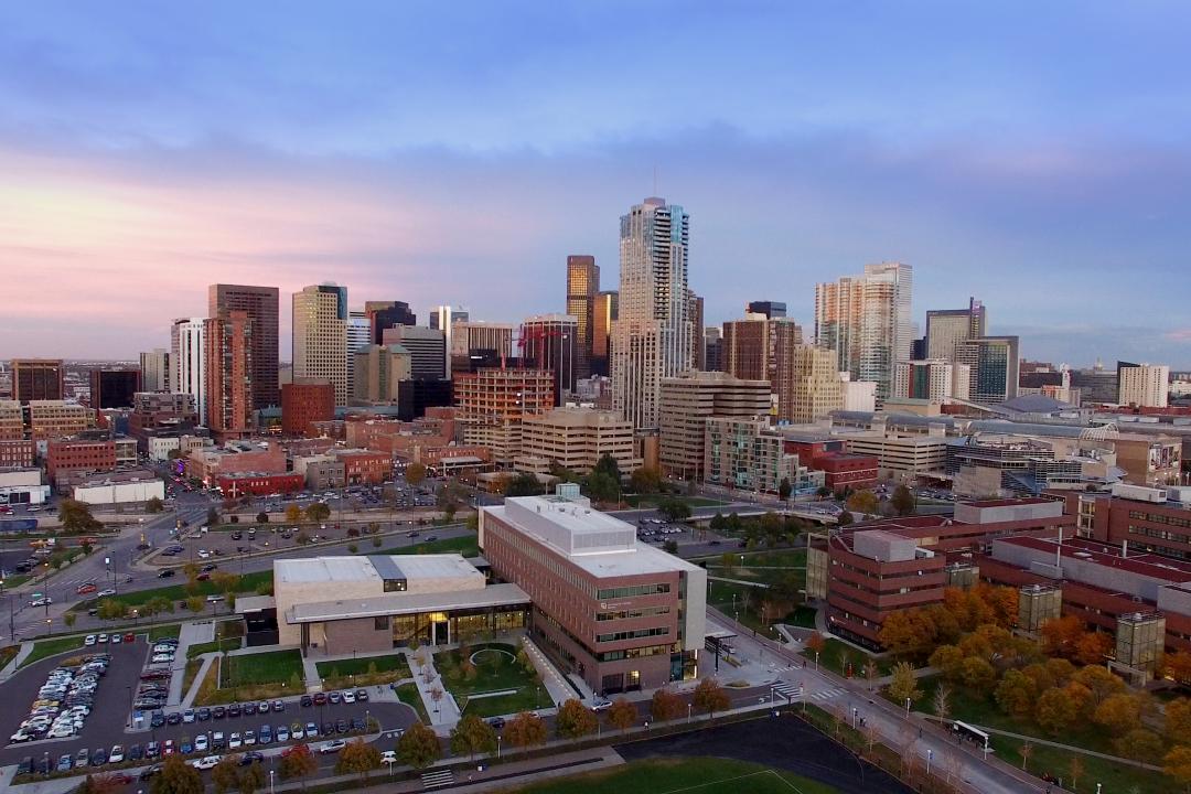 Photo of the Denver skyline taken near dusk.