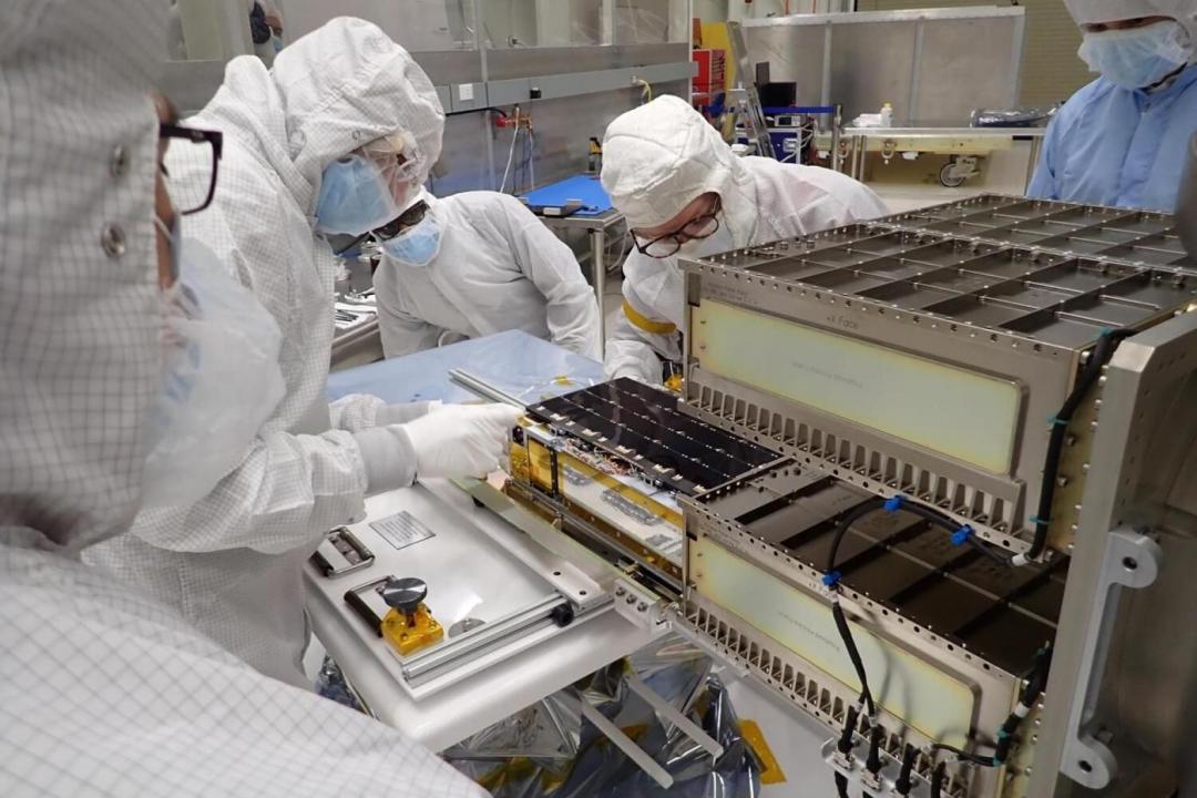 Photo of a team installing the Colorado Ultraviolet Transit Experiment, or CUTE, into its launch system.