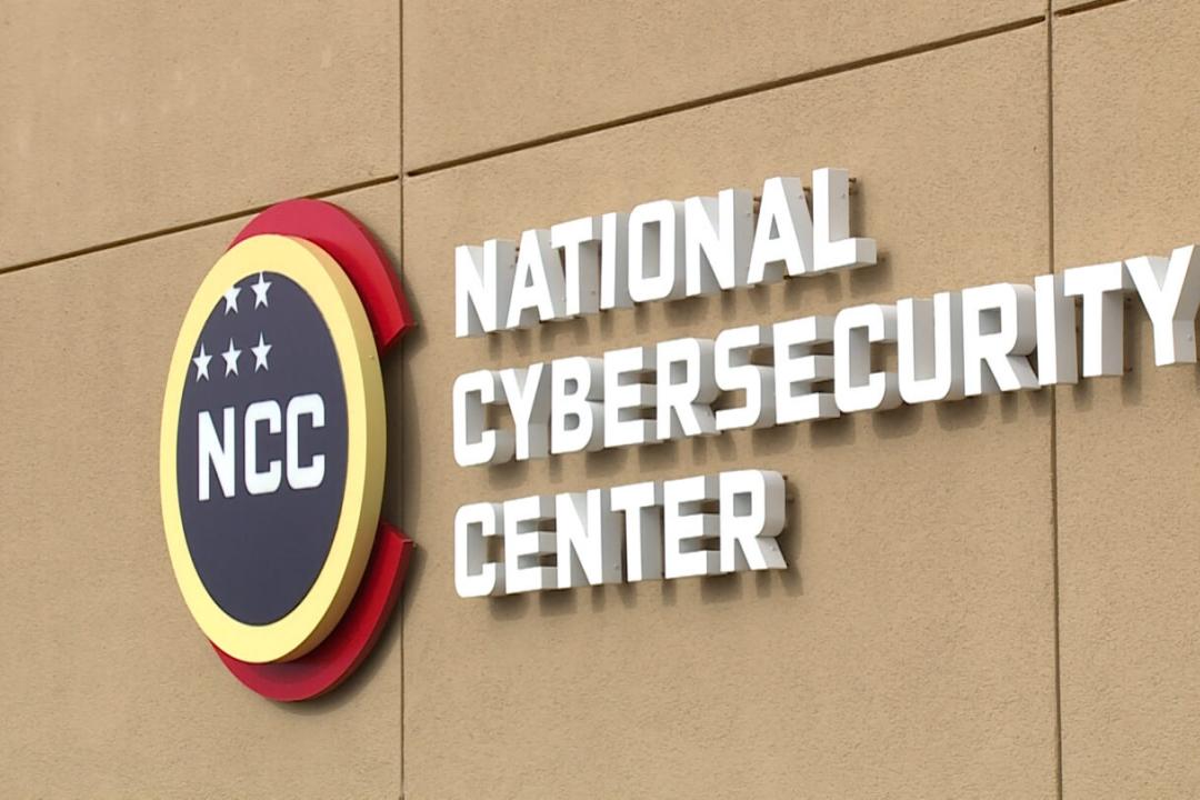 national cybersecurity center sign on side of tan building 