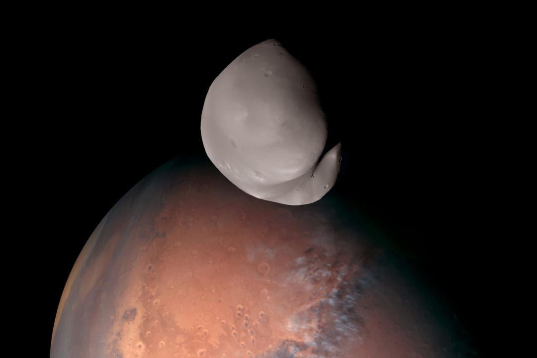 A striking view of Mars and its smallest moon, Deimos. This composite was created from several images taken by the EXI instrument aboard the Emirates Mars Mission when it traveled within about 100 km of Deimos. Credit: Emirates Mars Mission