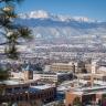 High-angle winter photo of the UCCS campus with the mountains in the background.