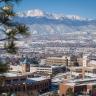 High-angle winter photo of the UCCS campus with the mountains in the background.