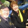 Photo of Al and Carole Shoffstall seated in the stands of an athletic event.