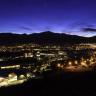 Photo of the UCCS campus at dusk with the mountains silhouetted in the background.