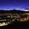 Photo of the UCCS campus at dusk with the mountains silhouetted in the background.