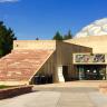 Fiske Planetarium building shot from the outside with tan brick and clear blue sky 